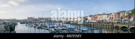 Scarborough Harbour and the property along  the South Bay. Lots of activity and boats on a lovely December day. Stock Photo