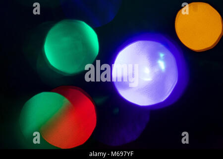 An out of focus view of coloured lights on a Christmas tree    Credit:  Ben Rector/Alamy Stock Photo Stock Photo