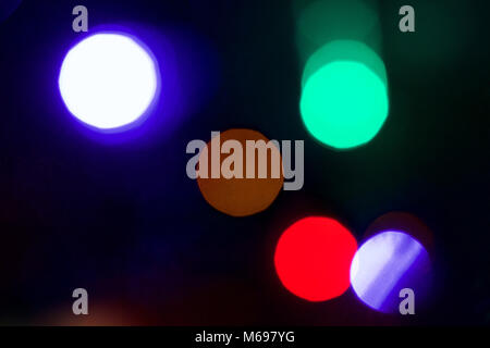 An out of focus view of coloured lights on a Christmas tree    Credit:  Ben Rector/Alamy Stock Photo Stock Photo