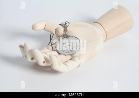 Wooden hand holding bitcoin keychain isolated on a white background Stock Photo
