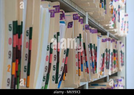 Medical records stored on a shelf Stock Photo
