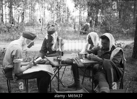 German soldiers wearing Mosquito protection nets on their heads in forest Near Babruysk USSR in June 1941 at the start of German invasion of Russia in WW2. Stock Photo