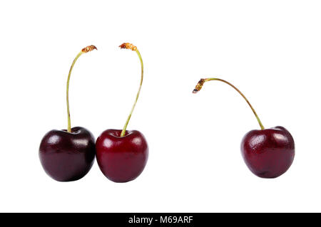 Three sweet cherries isolated on white Stock Photo
