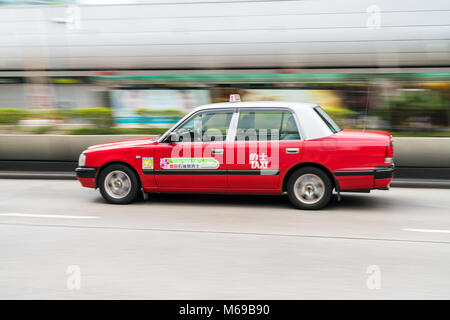 18 February 2018 - Hong Kong. Motion blurred shot of a typical taxi cab in Hong Kong. Stock Photo