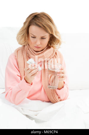 Woman having a cold, flu. Sore throat, coughing and fever Stock Photo