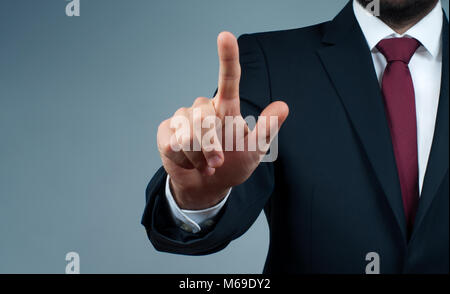 Businessman touching on the whiteboard. Businessman pressing buttons in the air Stock Photo