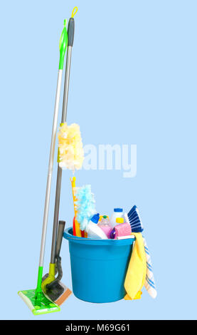 Variety of cleaning products in  bucket on pastel blue background Stock Photo