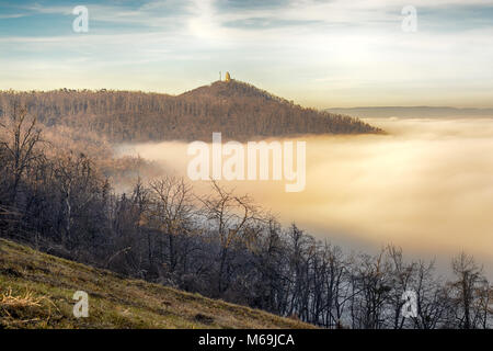 János Hill in Budapest with distant Elizabeth Lookout on top. Autumn, fog Stock Photo