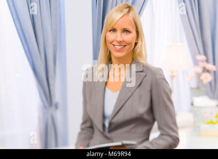 A female professional in her work space Stock Photo