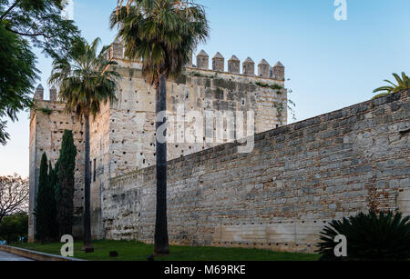 Part of the walls of the Alcazar of Jerez de la Frontera, a former Moorish alcázar, now housing a park, in Jerez de la Frontera, Andalusia, Spain. Stock Photo