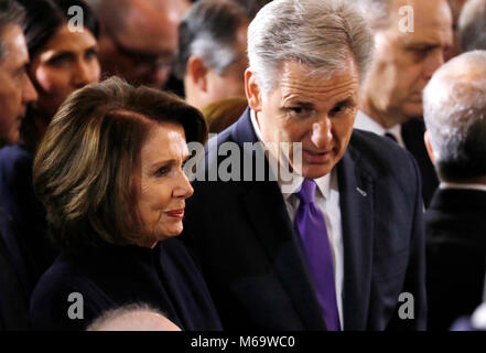Washington, USA. 28th Feb, 2018. United States House Majority Leader Kevin McCarthy (Republican of California), right, speaks with US House Minority Leader Nancy Pelosi (Democrat of California), left, as they await the start as the late evangelist Billy Graham lies in honor in the Rotunda of the U.S. Capitol in Washington, U.S. February 28, 2018. Credit: Aaron P. Bernstein/Pool via CNP - NO WIRE SERVICE · Credit: Aaron P. Bernstein/Consolidated News Photos/Aaron P. Bernstein - Pool via CNP/dpa/Alamy Live News Stock Photo