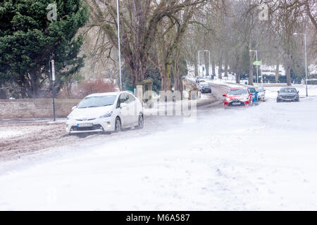 Northampton, England. 2nd Mar, 2018. UK Weather:. Slow moving commuter traffic on Park Ave South due to snow which is blowing off Abington Park in the strong winds and  drifting across the road,  temperatures of -6 overnight not counting for wind chill . Credit: Keith J Smith./Alamy Live News Stock Photo