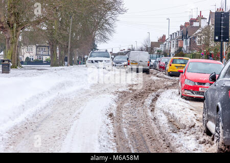 Northampton, England. 2nd Mar, 2018. UK Weather:. Slow moving commuter traffic on Park Ave South due to snow which is blowing off Abington Park in the strong winds and  drifting across the road,  temperatures of -6 overnight not counting for wind chill . Credit: Keith J Smith./Alamy Live News Stock Photo