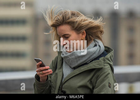 London, UK. 2nd Mar, 2018. UK Weather: The Beast from the East? More like hysteria from Siberia, some say. Commuters struggle accross London Bridge in freezing temperatures. The weather forcasters predicted heavy snow but it is only cold and not even that windy. Credit: Guy Bell/Alamy Live News Stock Photo