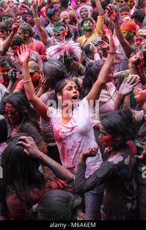 Guwahati, Assam, India. 2nd Mar, 2018. Coloured powder is thrown on men as they dance during Holi celebrations on street at Fancy Bazar, Guwahati, Assam, India. Credit: David Talukdar/Alamy Live News Stock Photo