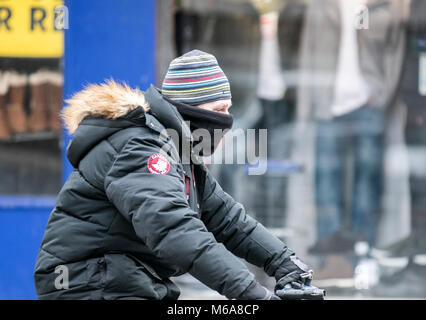 Blackpool, Lancashire. 2nd March 2018. UK Weather. Storm Emma strikes.  Strong winds blow across the seaside town of Blackpool in Lancashire as Storm Emma creates a bad hair day with tangled tresses & twisted locks as the windy weather whips through the town streets. Credit: Mediaworld Images/Alamy Live News Stock Photo