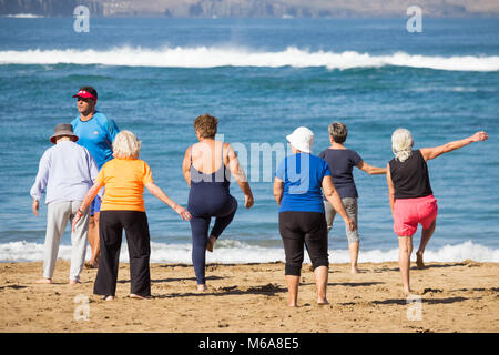 Pensioners daily keep fit class on beach in Spain Stock Photo