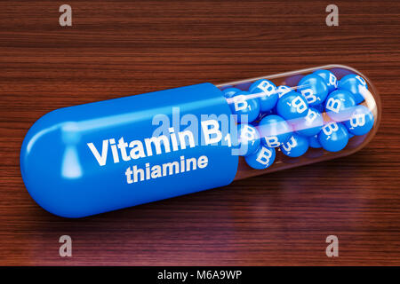 Vitamin capsule B1 on the wooden table. 3D rendering Stock Photo