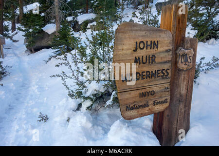 John Muir Wilderness Sign Entrance Table on Snowy Mount Whitney Hiking Trail, Sierra Nevada Mountains. Inyo County Lone Pine California US in Winter Stock Photo