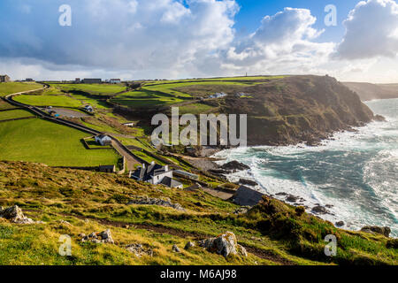 Looking south from the summit of Cape Cornwall towards the derelict cliff-side remains of a former Cornish tin mine, England, UK Stock Photo