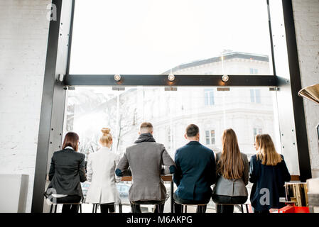 Business people sitting near the window Stock Photo