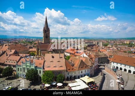 Sibiu skyline, Transylvania, Romania. Panoramic view of the Small Square (Piata Mica) with the old Catholic Cathedral and the Liars Bridge visible in  Stock Photo