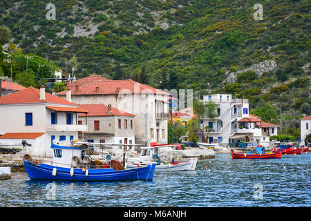 Fishing boats with nets in the traditional fisherman village on the island of Trikeri, Greece Stock Photo