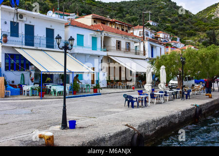 Greek harbour, fishing boats with nets in the traditional fisherman village on the island of Trikeri, Greece Stock Photo