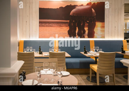 a table is laid out in a fine dining restaurant  ready to eat Stock Photo