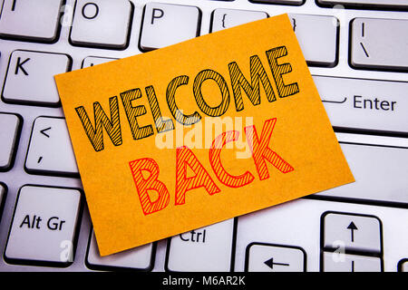 Conceptual hand writing text caption inspiration showing Welcome Back. Business concept for Emotion Greeting written on sticky paper on the white keyb Stock Photo