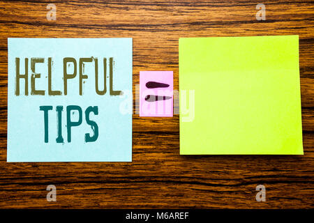 Word, writing Helpful Tips. Business concept for Help in FAQ or Advice, written on sticky note paper wooden background. Equation mathematical sign for Stock Photo