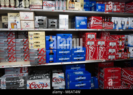 A walk in cooler, or beer cave, in a grocery store in Speculator, NY USA full of different brands of beer and ale. Stock Photo