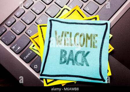 Conceptual hand writing text caption inspiration showing Welcome Back. Business concept for Emotion Greeting written on sticky note paper on dark keyb Stock Photo