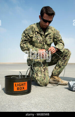 BAHRAIN (Feb 26, 2018) Explosive Ordnance Disposal Technician 2nd Class Vasya Mstislavski, assigned to Task Force 50, builds a vehicle disruptor during a vehicle-borne improvised explosive device operation as part of Neon Response 18 at the Bahrain Defense Force (BDF) military operations in urban terrain site. Neon Response 18 is a bilateral maritime security and explosive ordnance disposal exercise between the U.S. Navy and BDF to enhance interoperability. (U.S. Navy Stock Photo