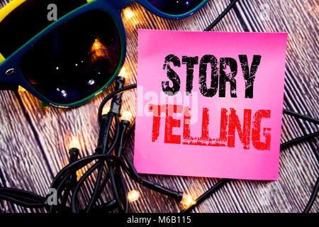 Hand writing text caption showing Storytelling. Business concept for Teller Story Message written on the wood with sunglasses copy space Stock Photo