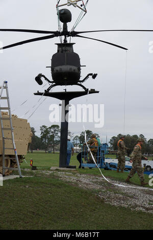 The OH-58 Kiowa comes to rest in its final position at the Fort Stewart main gate static display Feb. 26. Stock Photo