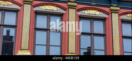Gold painted pilasters giving the appearance of supporting columns is a fine example of an architectural element of classical architecture in Bruges Stock Photo