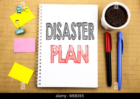 Word, writing Disaster Plan. Business concept for Emergency Recovery Written on notepad paper background with space office view with pencil marker cof Stock Photo