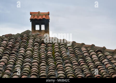 Closeup of an old rotting chimney of a small house in a village Stock Photo