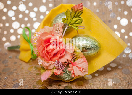 Gift composition for Easter with chocolate eggs and fabric flowers in the studio09 Stock Photo