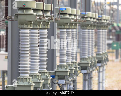 Close up of modern  isolators on High voltage electricity transformation substation Stock Photo