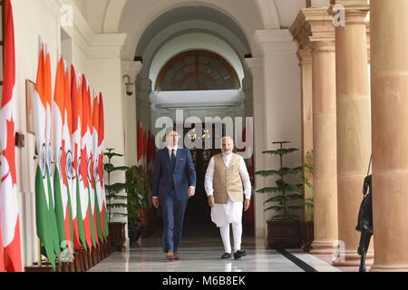 Indian Prime Minister Narendra Modi, right, escorts Canadian Prime Minister Justin Trudeau at Hyderabad House February 23, 2018 in New Delhi, India. Stock Photo