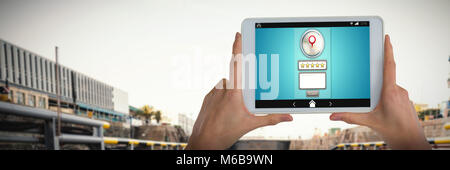 Composite image of womans hand holding digital tablet Stock Photo