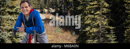 Composite image of digital composite of senior man with his bike Stock Photo