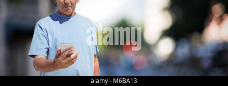 Composite image of senior man using smart phone Stock Photo