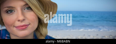 Composite image of close up portrait of smiling young blonde woman Stock Photo