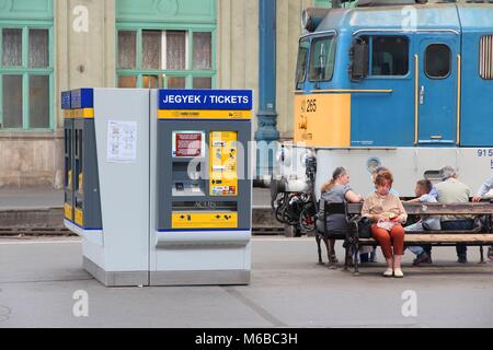 BUDAPEST, HUNGARY - JUNE 19, 2014: Travelers wait at Nyugati Railway Station in Budapest. It is the western train station and was opened in 1877. Stock Photo