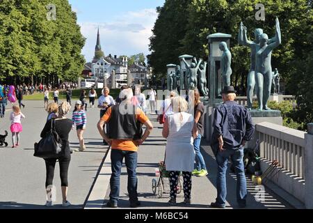 OSLO, NORWAY - AUGUST 2, 2015: People visit gardens and Vigeland Installation in Frogner Park, Oslo. 212 sculptures around the park were all designed  Stock Photo