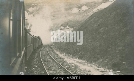 Antique c1900 photograph, steam train entering tunnel. Location unknown, possibly Europe. Stock Photo