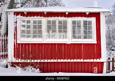 Frosty windows on a Swedish cottage Stock Photo
